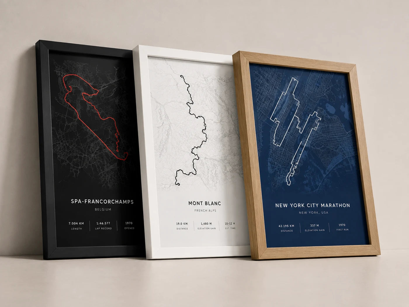 Three custom route artworks in black, white and oak frames